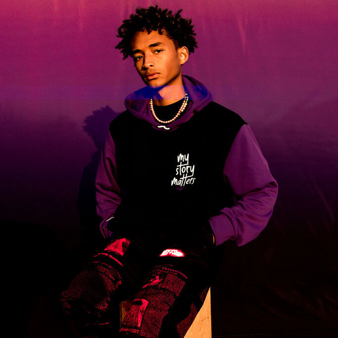 Jaden Smith leaning on box wearing New Balance clothing