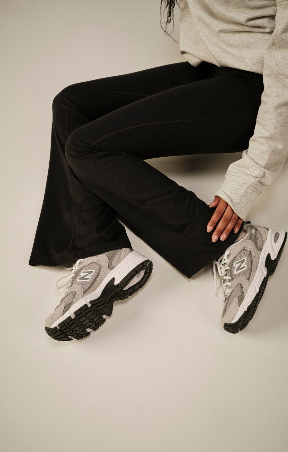 closeup of a woman's legs wearing 530 sneakers