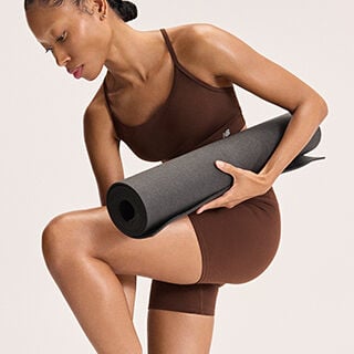 Woman preparing to do yoga 