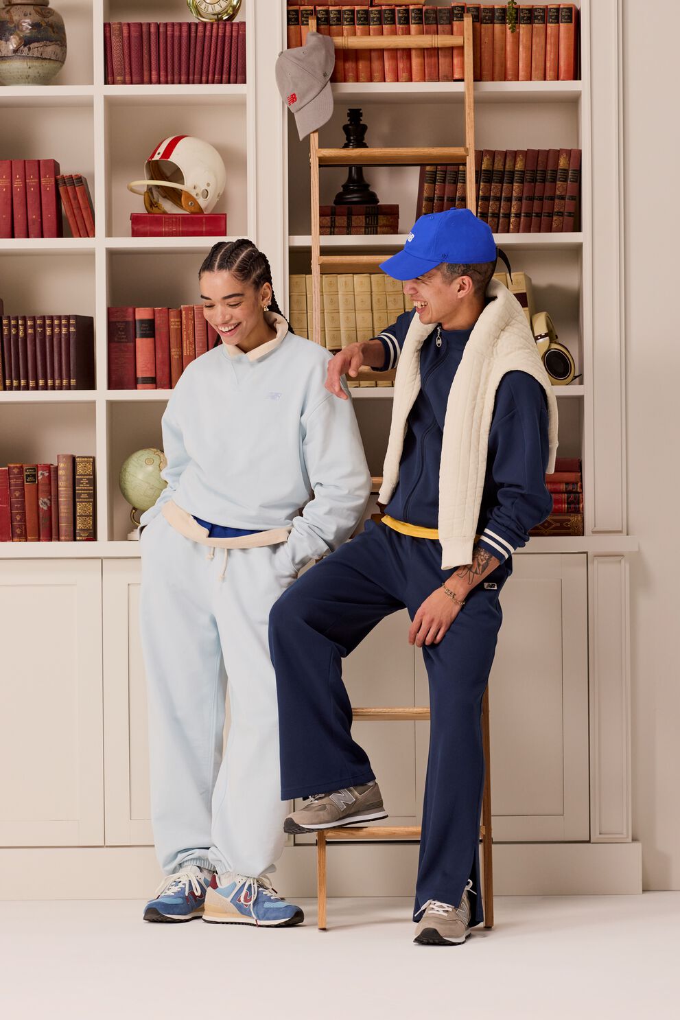 Two people wearing new balance 574 sneakers