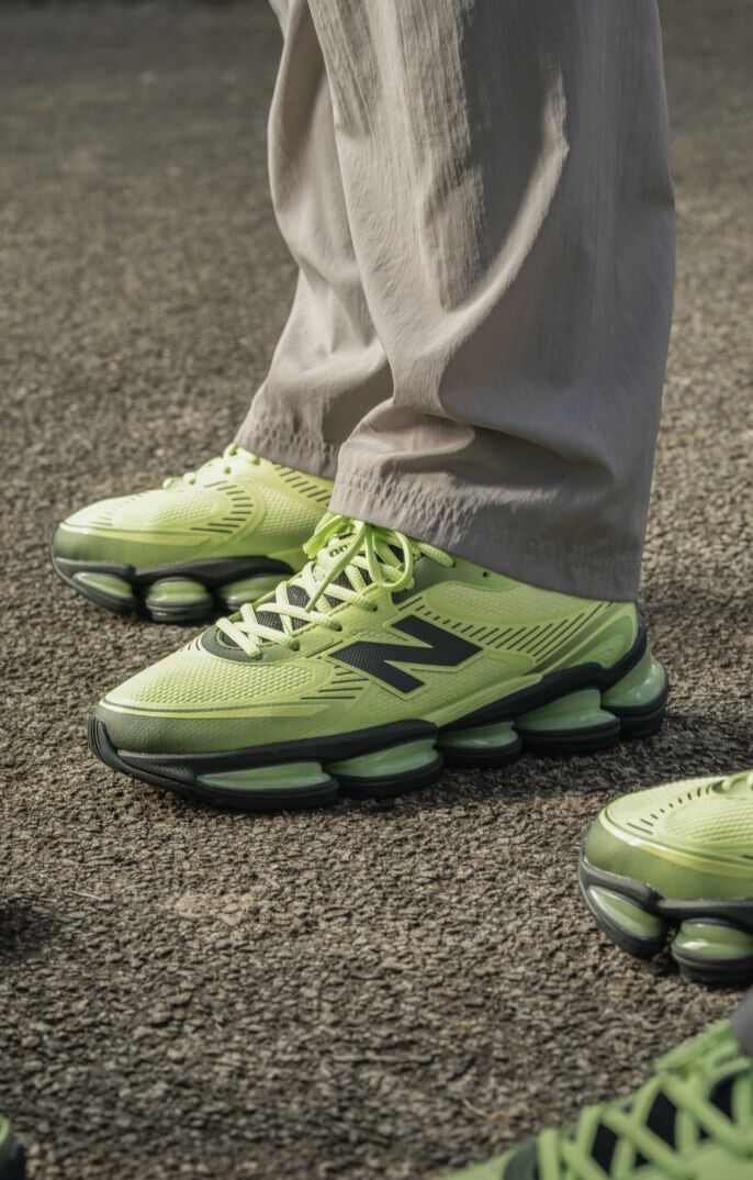 On-figure shot of the lime green shoes worn by three different people. 
