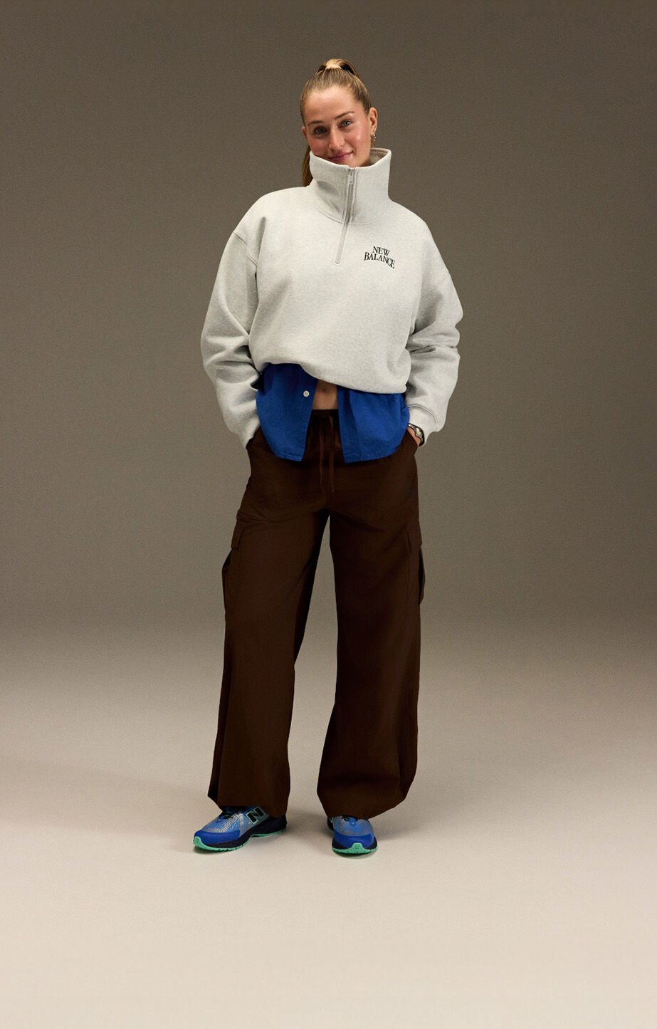 Jordyn Huitema standing in front of a gray backdrop. 