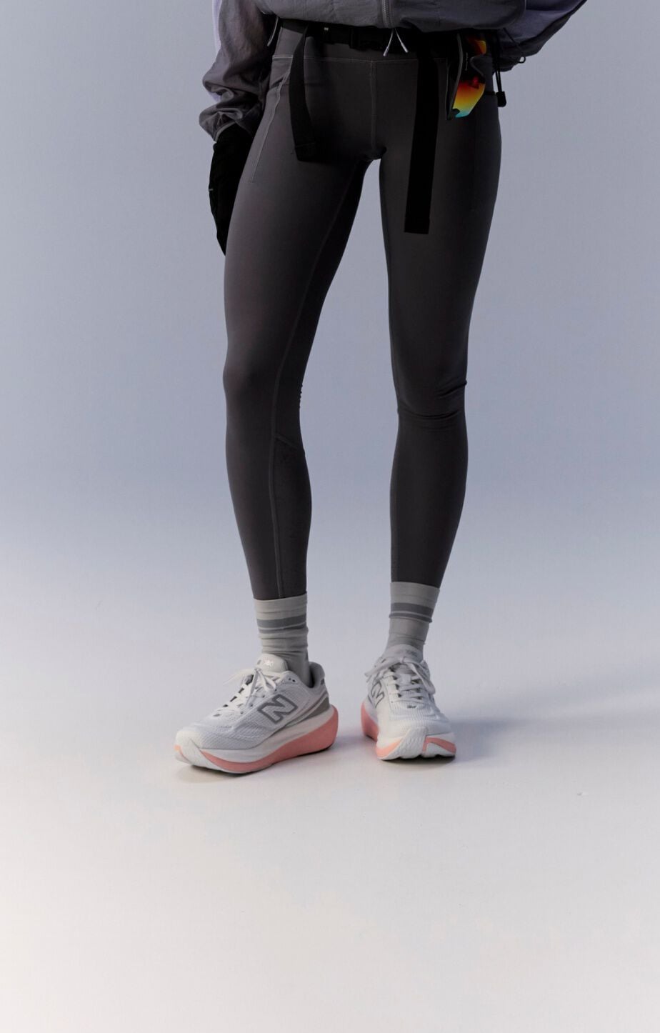 Knee down image of person tying a pair of 1080v15 running shoes 
