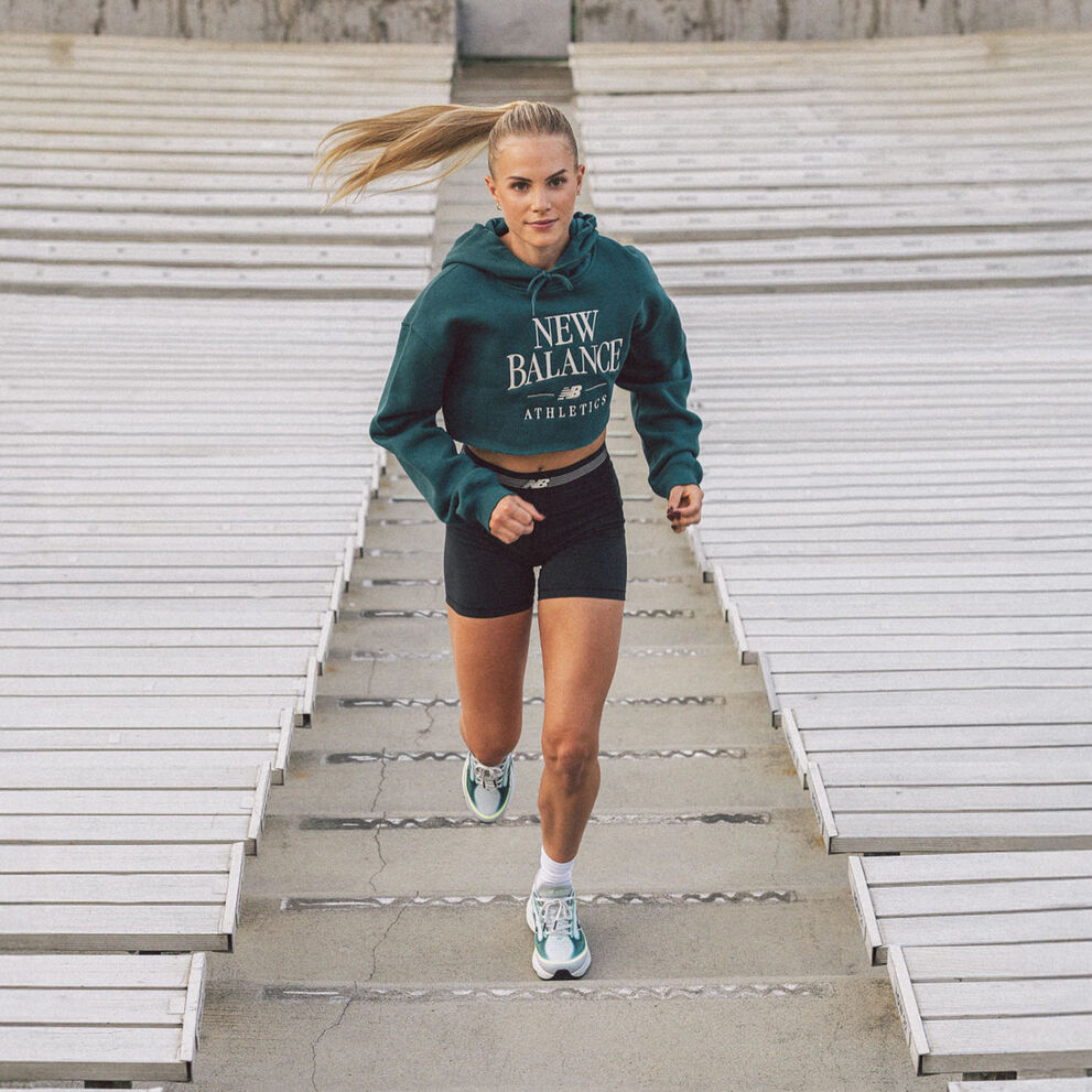 Parker Valby running up bleacher stairs 