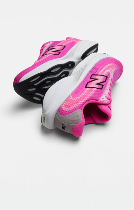 Pair of pink running shoes on a white background 