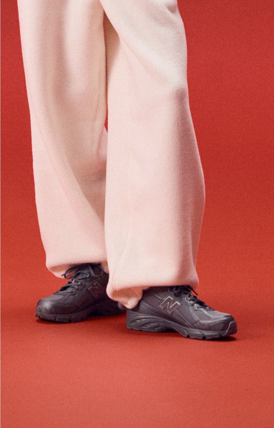 Close up of a person wearing new balance 740s