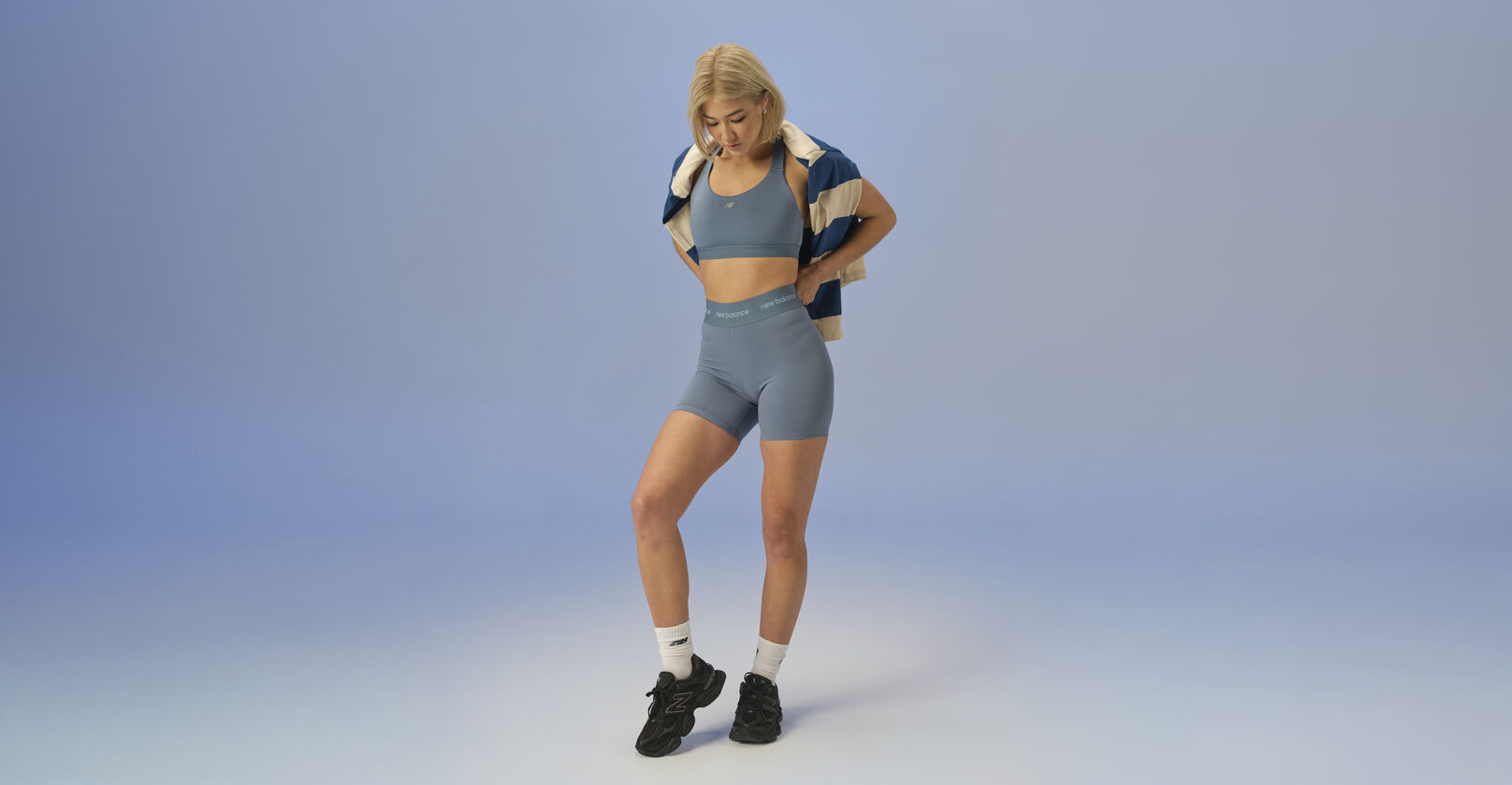 woman in studio background wearing 9060 sneakers