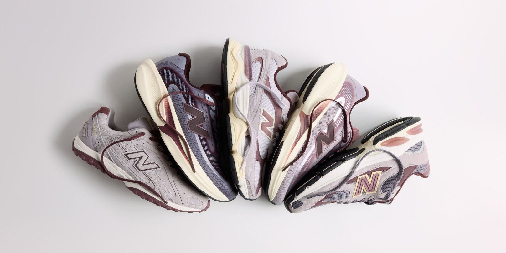 The Crimson Fog Pack laying fanned out on a grey background