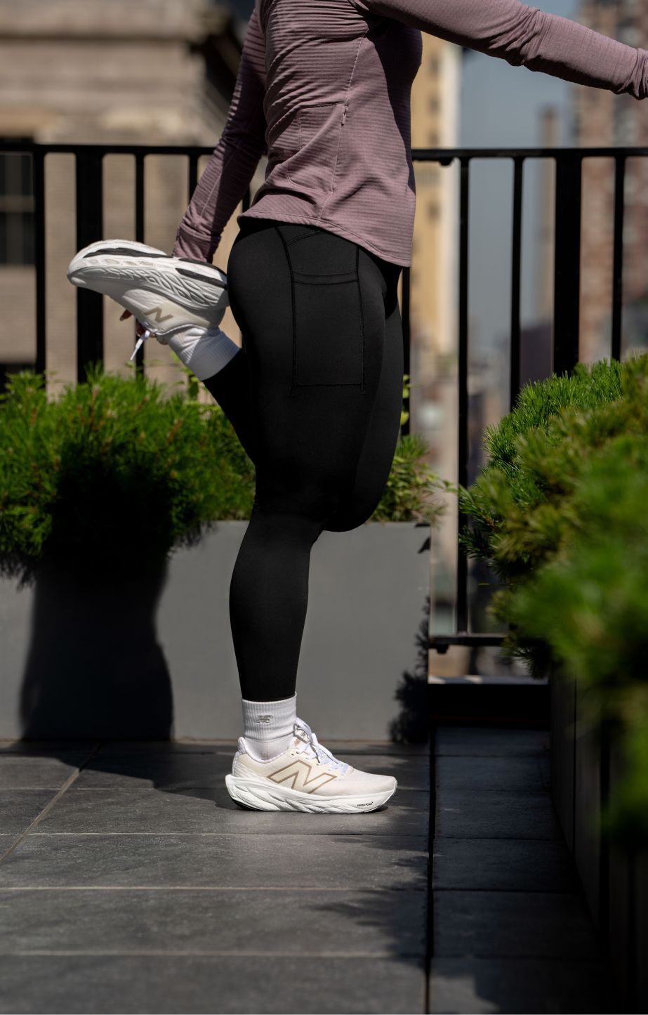 Close-up of lower legs wearing new balance 1080v14 running shoes