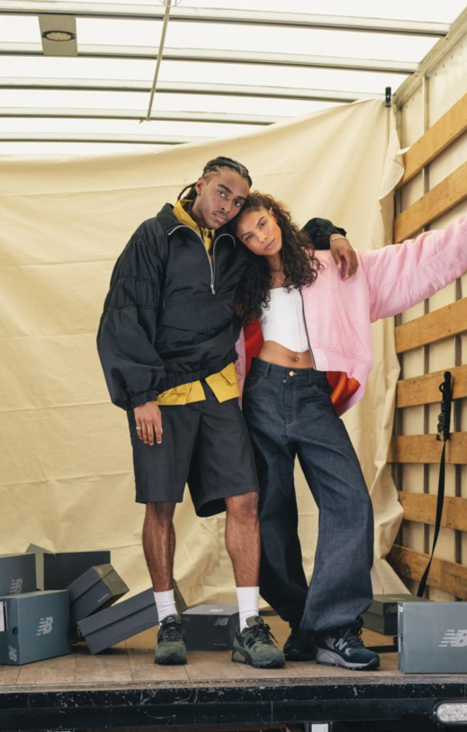 a man and woman wearing New Balance 580 Runners