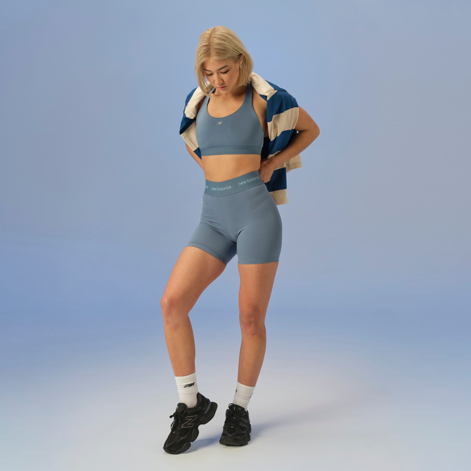 Women wearing the New Balance 9060 sneakers in a studio background