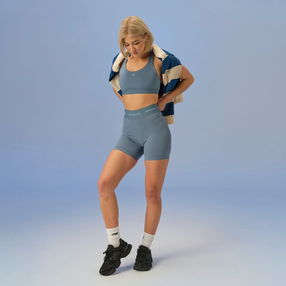 woman in studio background wearing 9060 sneakers