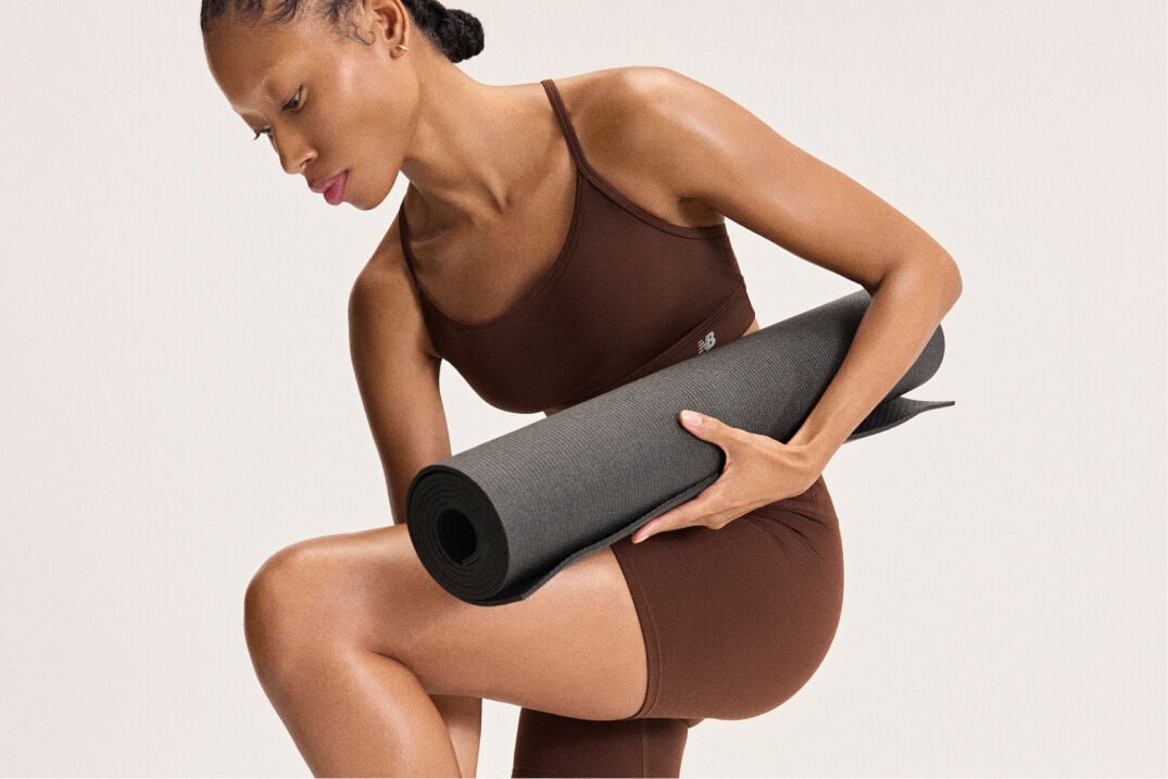 Woman preparing to do yoga 