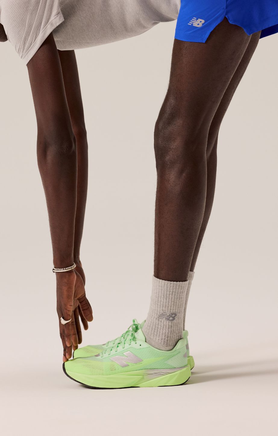 Man wearing new balance fuelcell rebel v5 running shoes