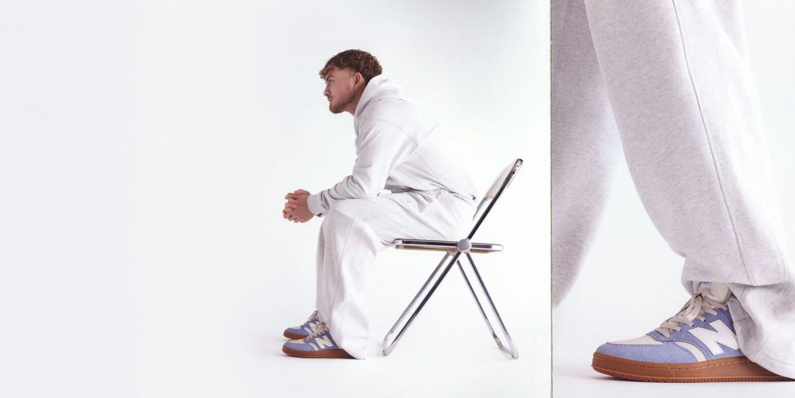 Harvey Elliott sitting on a chair wearing T500 shoes. 